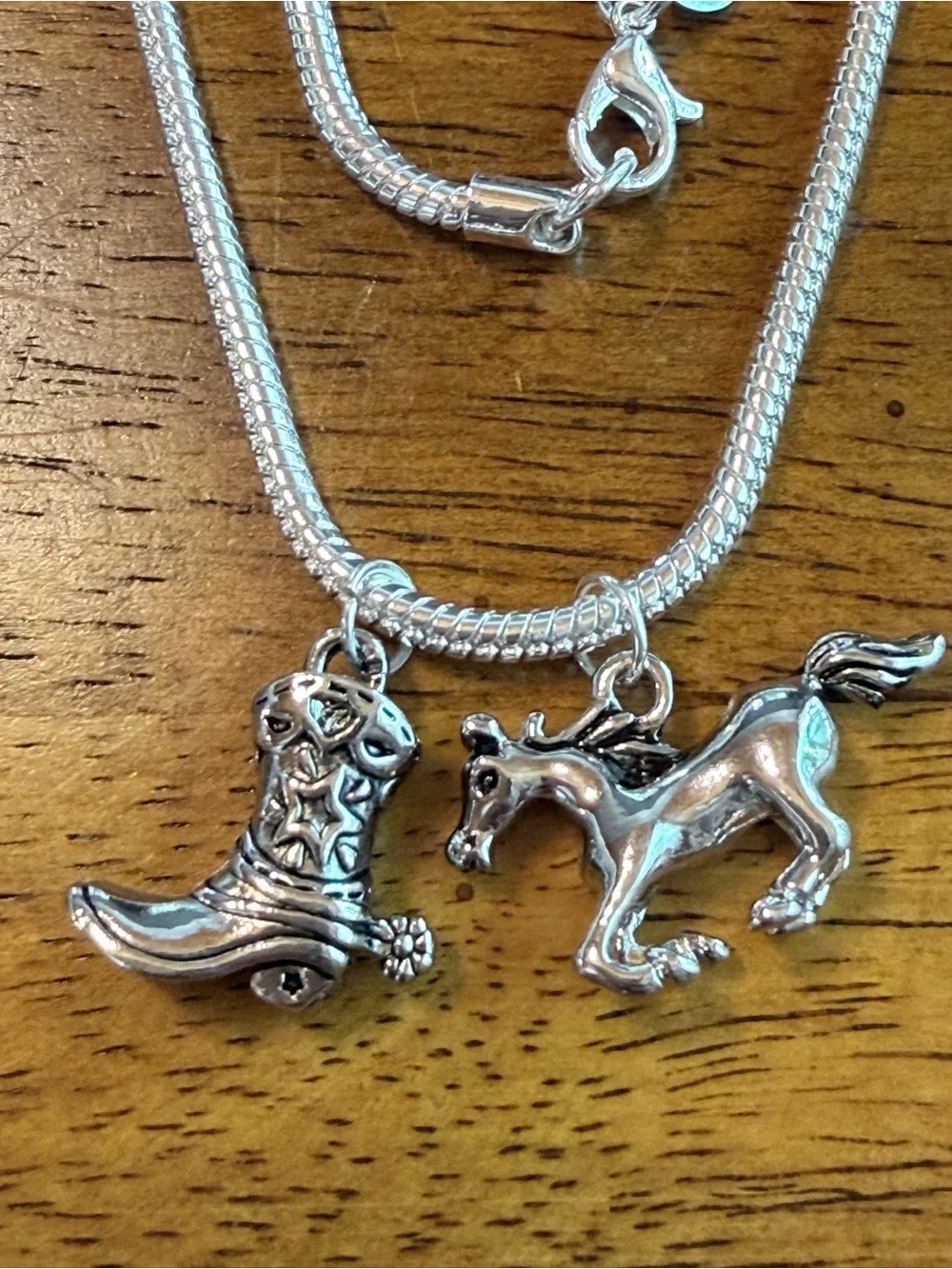 925 sterling silver necklace.23”snake chain,running horse & cowboy boot pendants